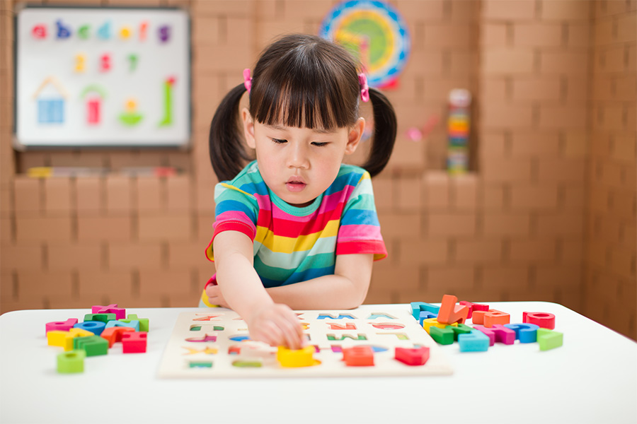 cute-boy-playing-with-toy-table