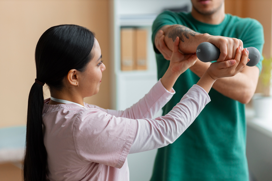 doctor-helping-patient-rehabilitation